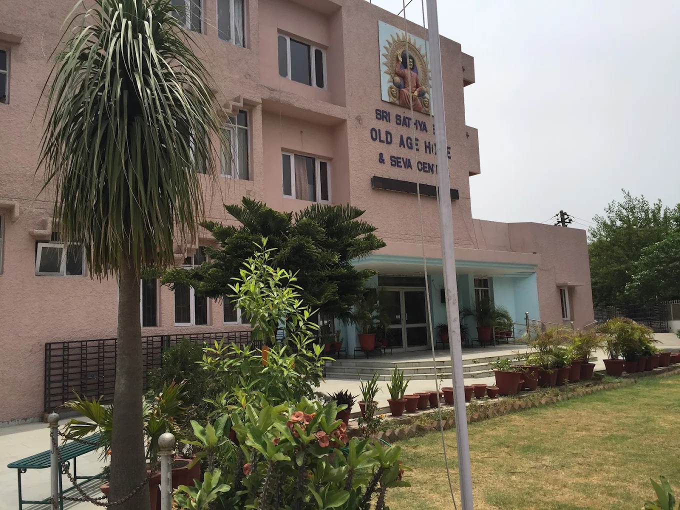Sri Sathya Sai Old Age Home exterior and garden